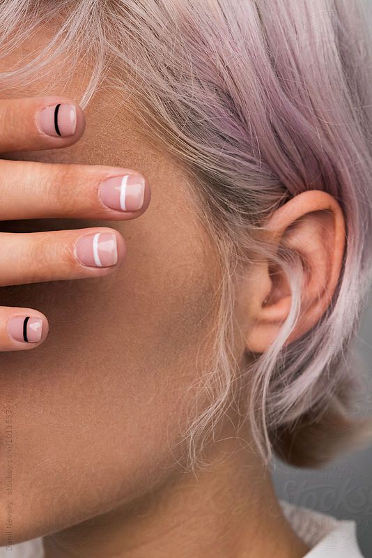 Close-up Of Pink-haired Girl With Manicure” by Stocksy Contributor “Danil Nevsky